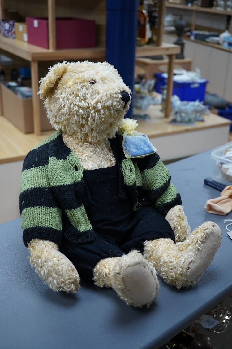 A Steiff artificial silk Teddy bear, (5650.2), jointed blonde body, stitched snout and glass eyes, button in ear, with related book and papers, bear 50cm